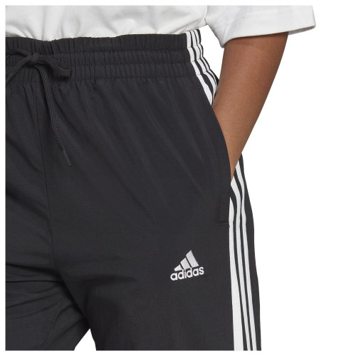 Adidas Γυναικείο παντελόνι φόρμας Essentials W 3-Stripes Woven 7/8  Pants